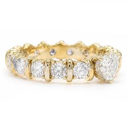 18ct gold diamond eternity ring, set with a single heart cut diamond of approx 0.50 carat and sixteen round brilliant cut diamonds, total diamond weight approx 1.95 carat