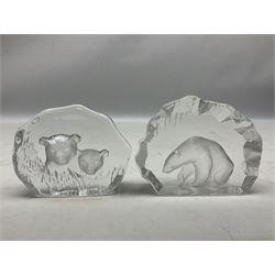 Two Mats Jonasson, Sweden paperweights, comprising polar bear in ice cave no 3152 and lion cubs, both with etched marks beneath, tallest H11.5cm