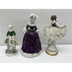 Continental figure modelled as a girl holding her lace skirt upon a circular base, together with two other figures, largest H22cm