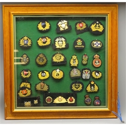  Collection of Merchant Navy and other cap badges mostly bullion wire work decorated incl. Oransje Line, US & Chile Navy, Turkey Nat. Line, Australian Lifeboat US Coastguard etc, in glazed frame, 69cm, (30)   