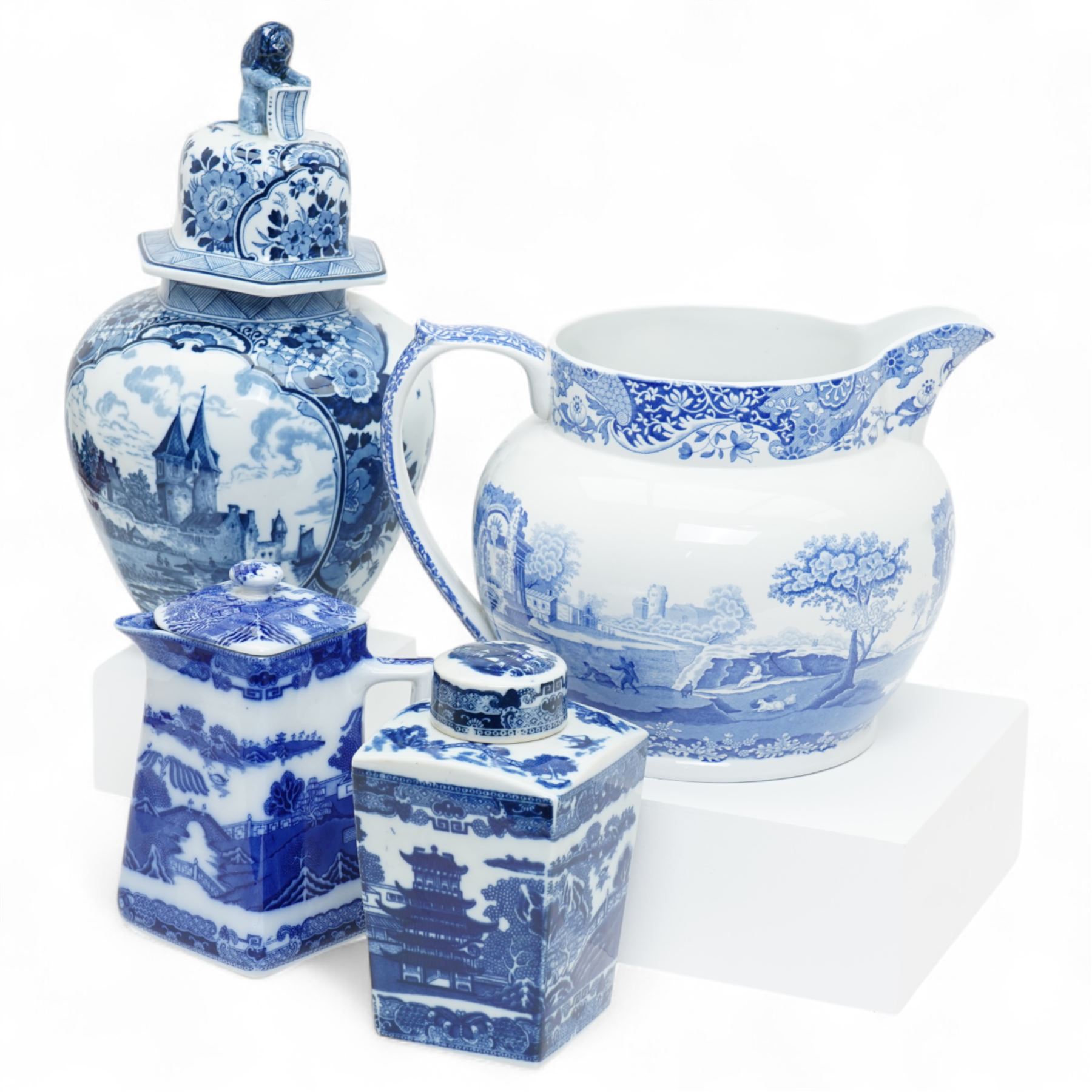 Large Spode Italian blue and white jug H23cm, 20th century Delft vase and cover decorated with landscape and floral design H38cm, Ringtons Tea Merchants blue and white tea caddy H20cm and a Ringtons jug (4)
