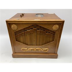 Small scratch built wooden John Smith style twenty-note busker organ with thirteen paper music rolls, other paper music and soft toy monkey