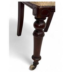 Victorian mahogany centre table, circular top above turned pedestal, terminating on three cabriole legs with scroll feet on porcelain castors, and six scroll carved upholstered dining chairs, with cushion and spindle turned backs, centre table  118x74cm, dining chairs 89x46x50cm