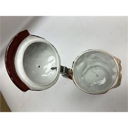 Otto Von Bismarck figural 0.5l stein, his black pickelhaube helmet with chrome spike serving as the lid, in green uniform and gilt detail throughout, pewter thumb hinge, with blue hash Musterschutz type mark, H18cm