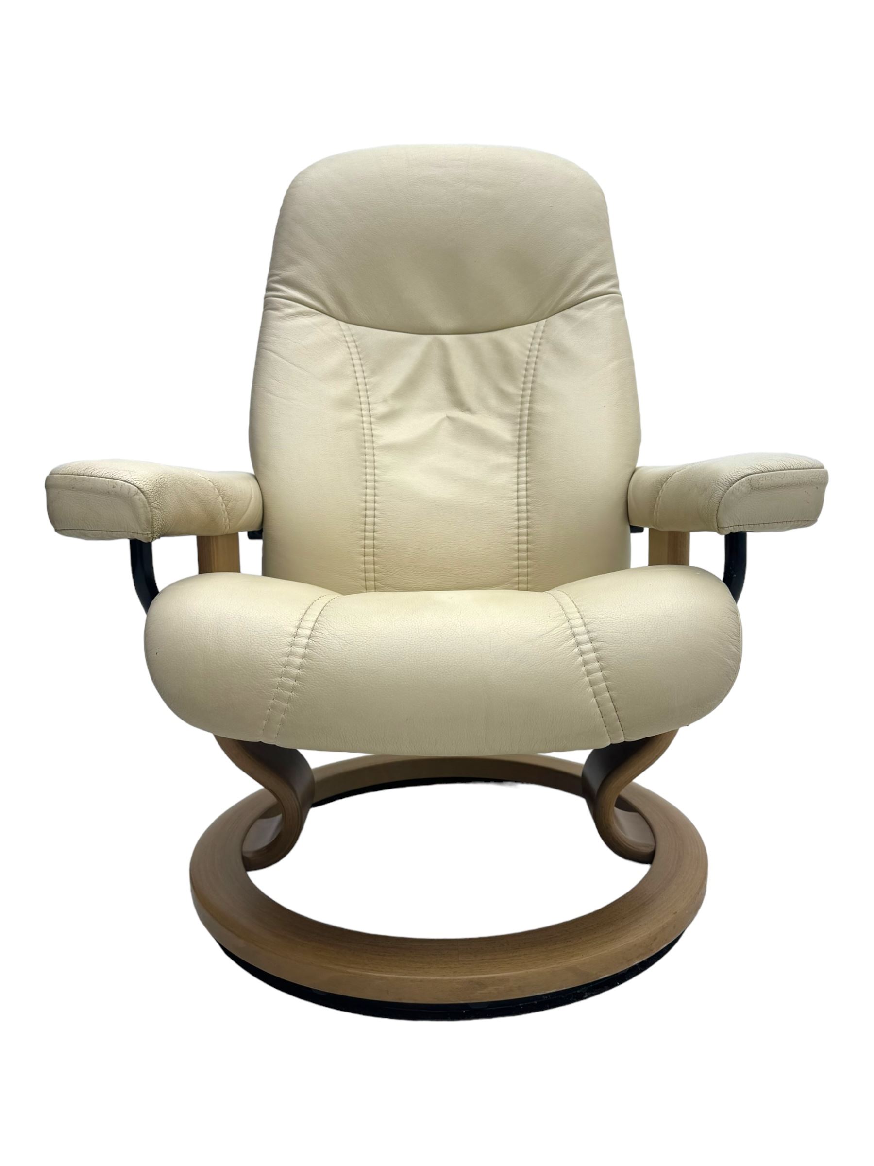 Ekornes Stressless - swivel and reclining armchair upholstered in cream leather, high back and padded armrests, raised on circular base