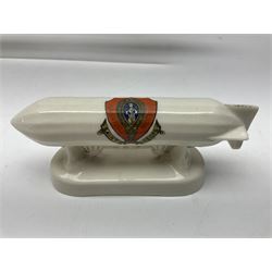 Ten WW1 crested china military models comprising submarine, four ships including Lusitania, four Zeppelins/balloons and an aircraft; various makers including Arcadian China, Swan China, Carlton China, Waterfall, Grafton China etc; various crests including Saint Neots, Great Yarmouth, Tewksbury, Swanage, Simons Town, Hull etc (10)