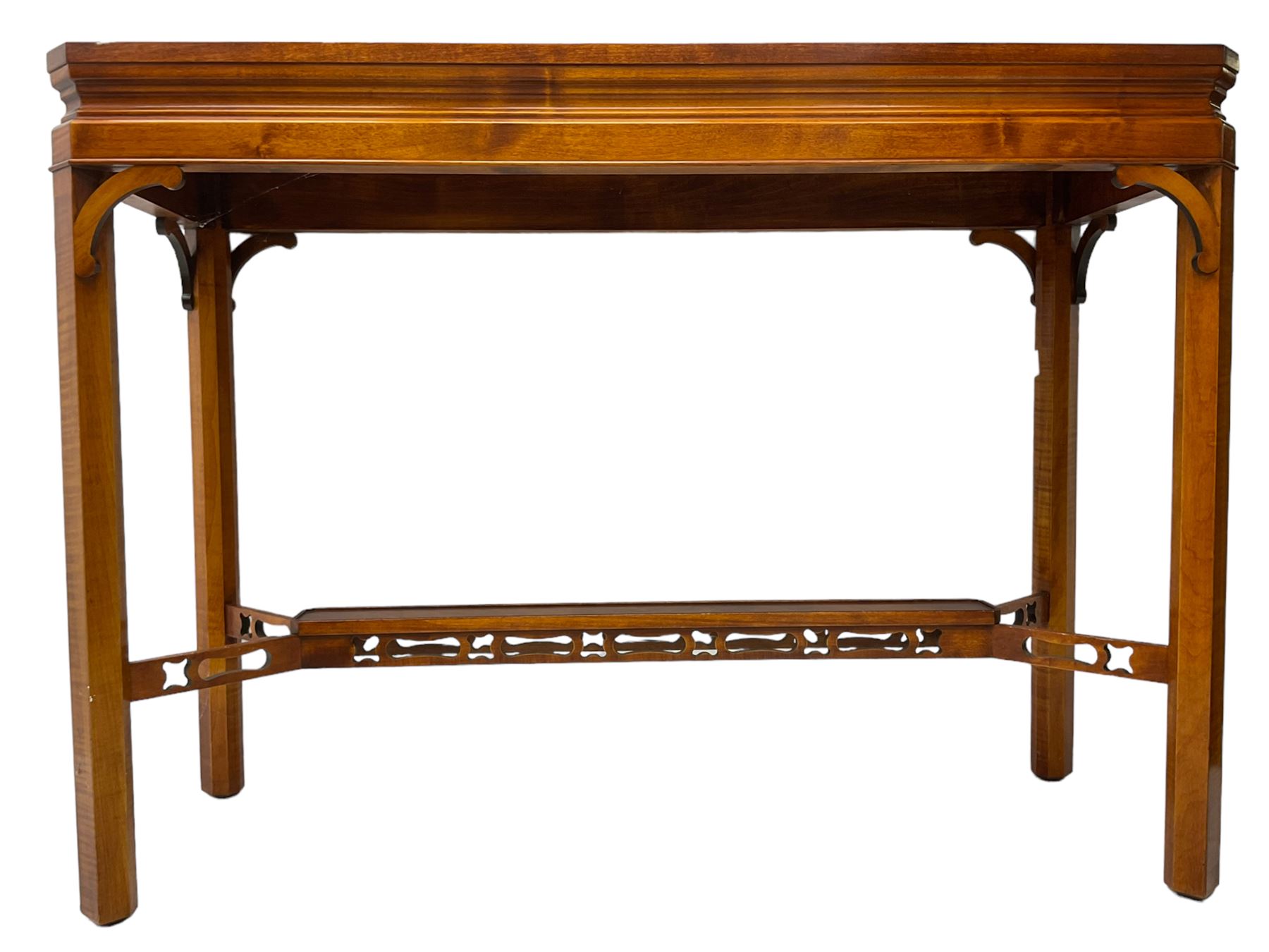 Wade - yew wood console table, rectangular top with canted corners and raised lipped edge, on chamfered square supports united by narrow under-tier