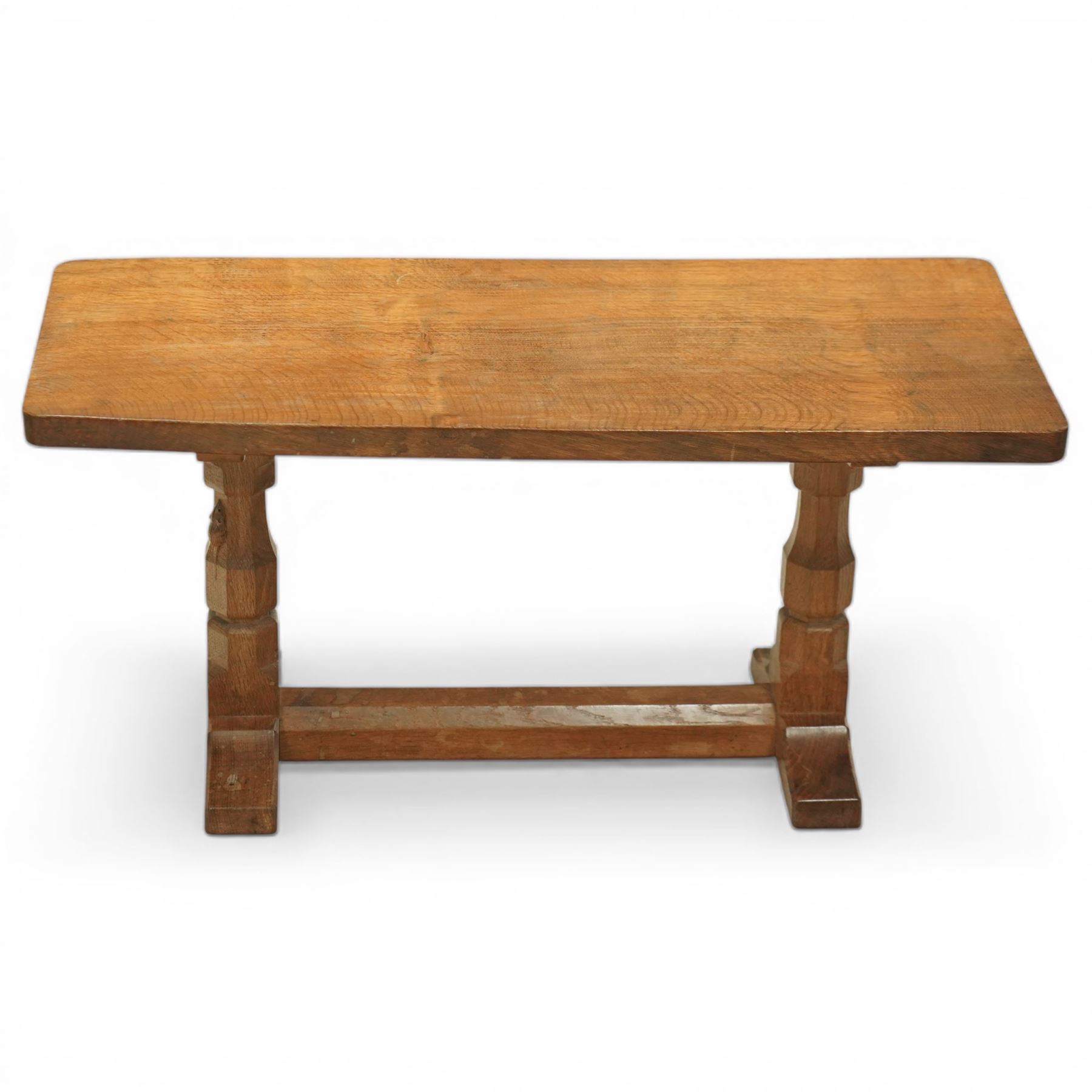 Mouseman - oak rectangular adzed coffee table, octagonal supports united by stretcher terminating in sled feet, with carved mouse signature, by the workshop of Robert Thompson of Kilburn 