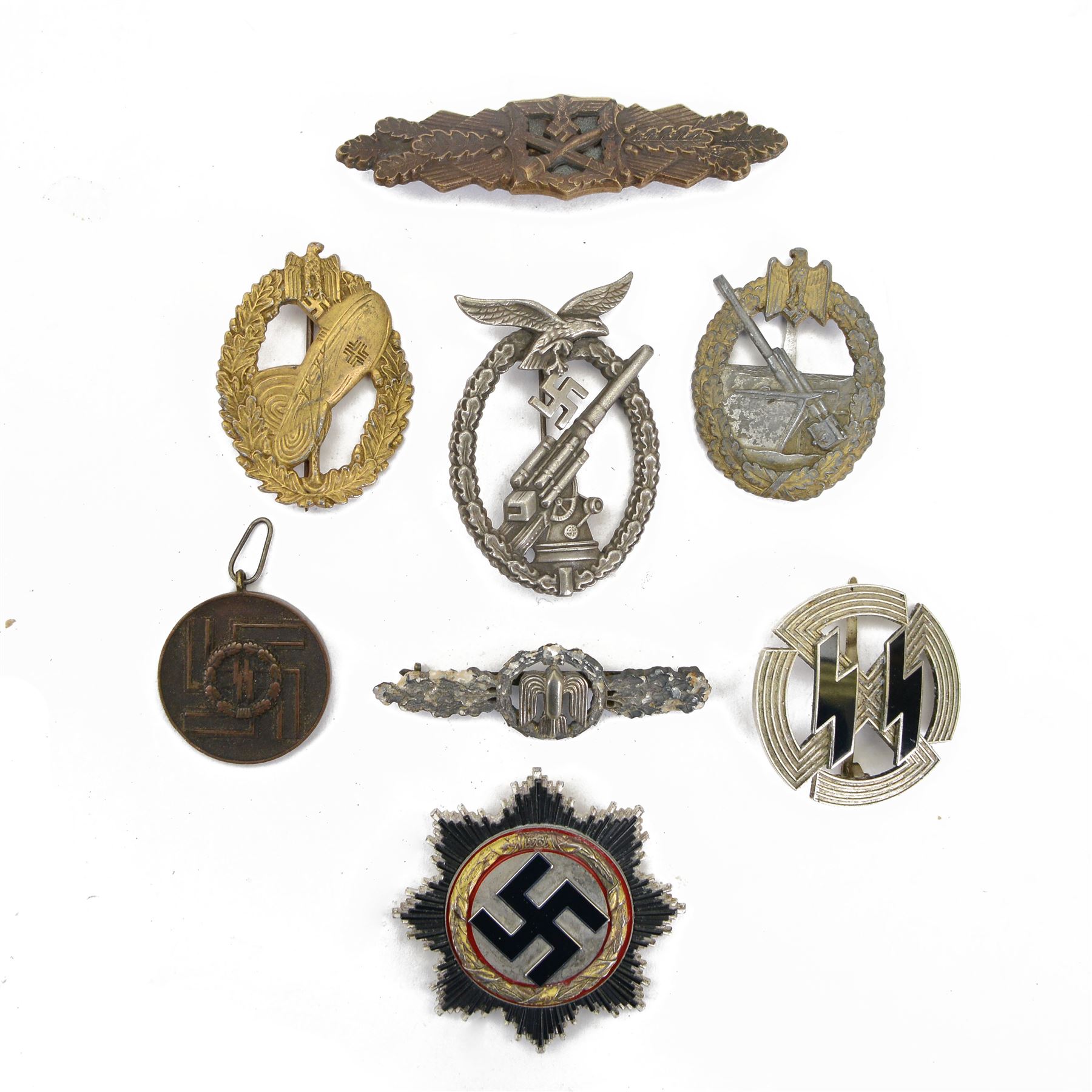 Eight German style badges including Bombers piolet clasp, Proficiency Rune, German Cross in gold etc 