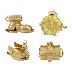 Four 9ct gold pendant/charms including Swan Lake, treasure chest, 'Time and tide waits for no man' and shoe house