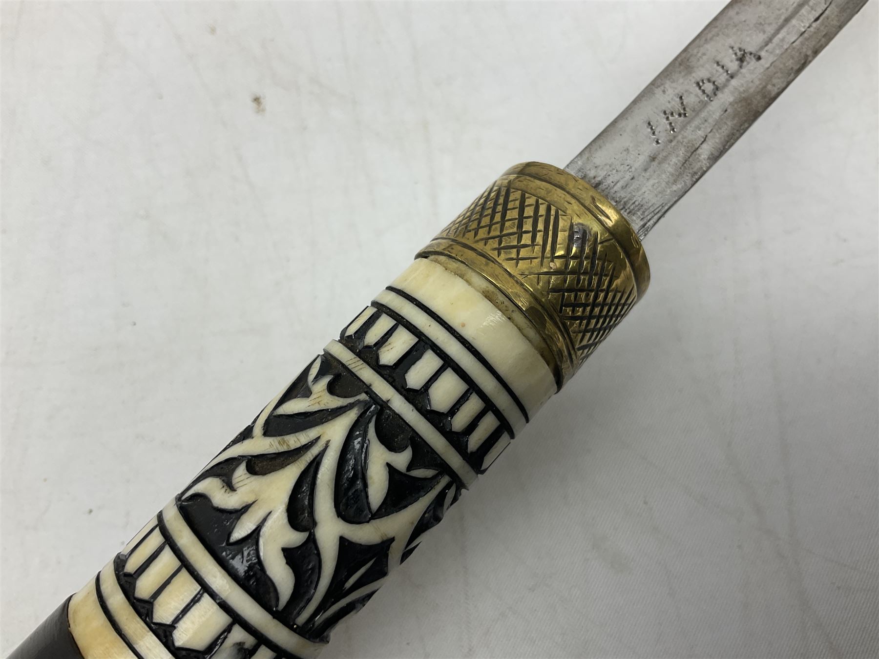 Late 19th/early 20th century Anglo Indian ebony and bone sword stick with 62cm steel blade, brass locking ferrule and lion mask pommel L92 cm.