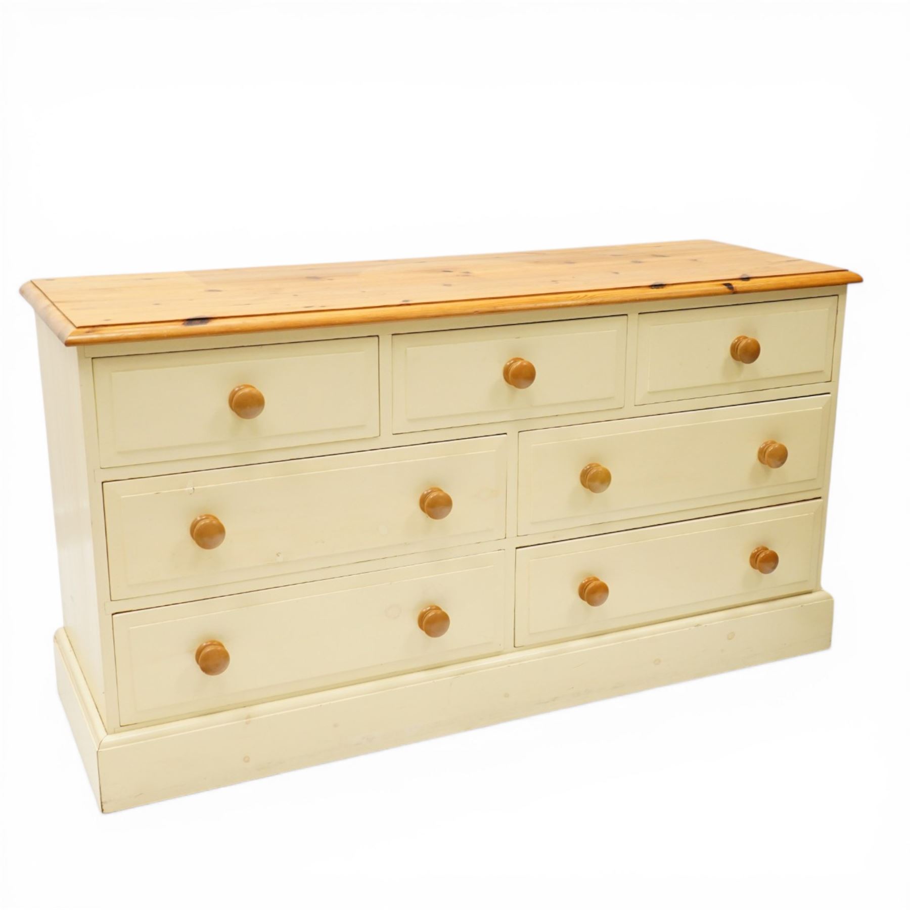 20th century painted pine chest, rectangular top over an assortment of seven drawers, on skirted base