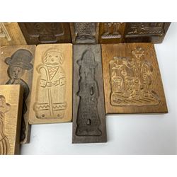 Collection of 20th century hardwood Dutch folk art Speculaasplank or biscuit moulds, most examples typically carved with figures in traditional dress, largest H35cm