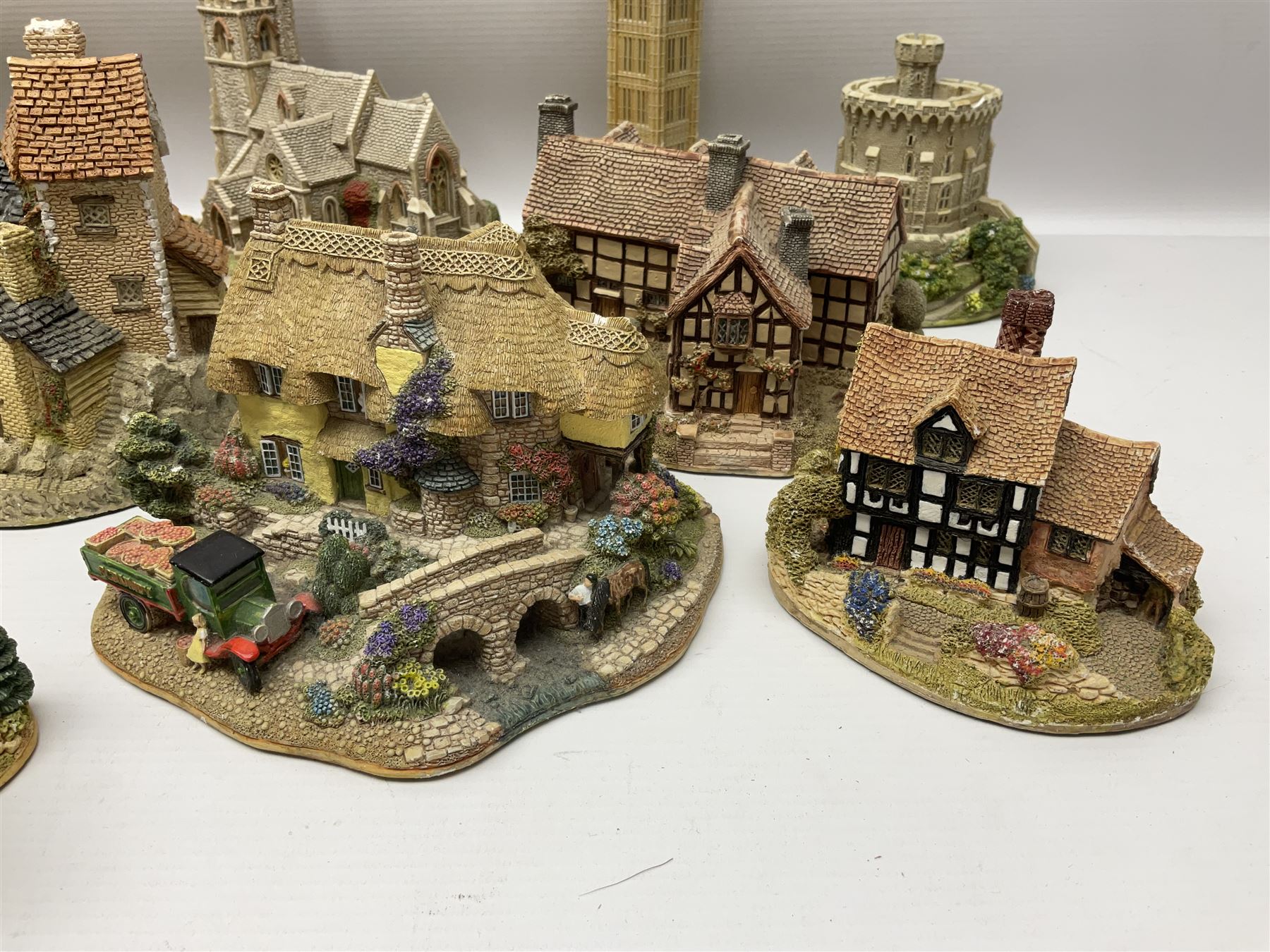 Twenty six Lilliput Lane models, to include Golden Harvest, Junk and Disorderley, Heaven Lea Cottage, Old Scrumpy Farm, Chantry Chapel Wakefield, etc, together with four similar cottages