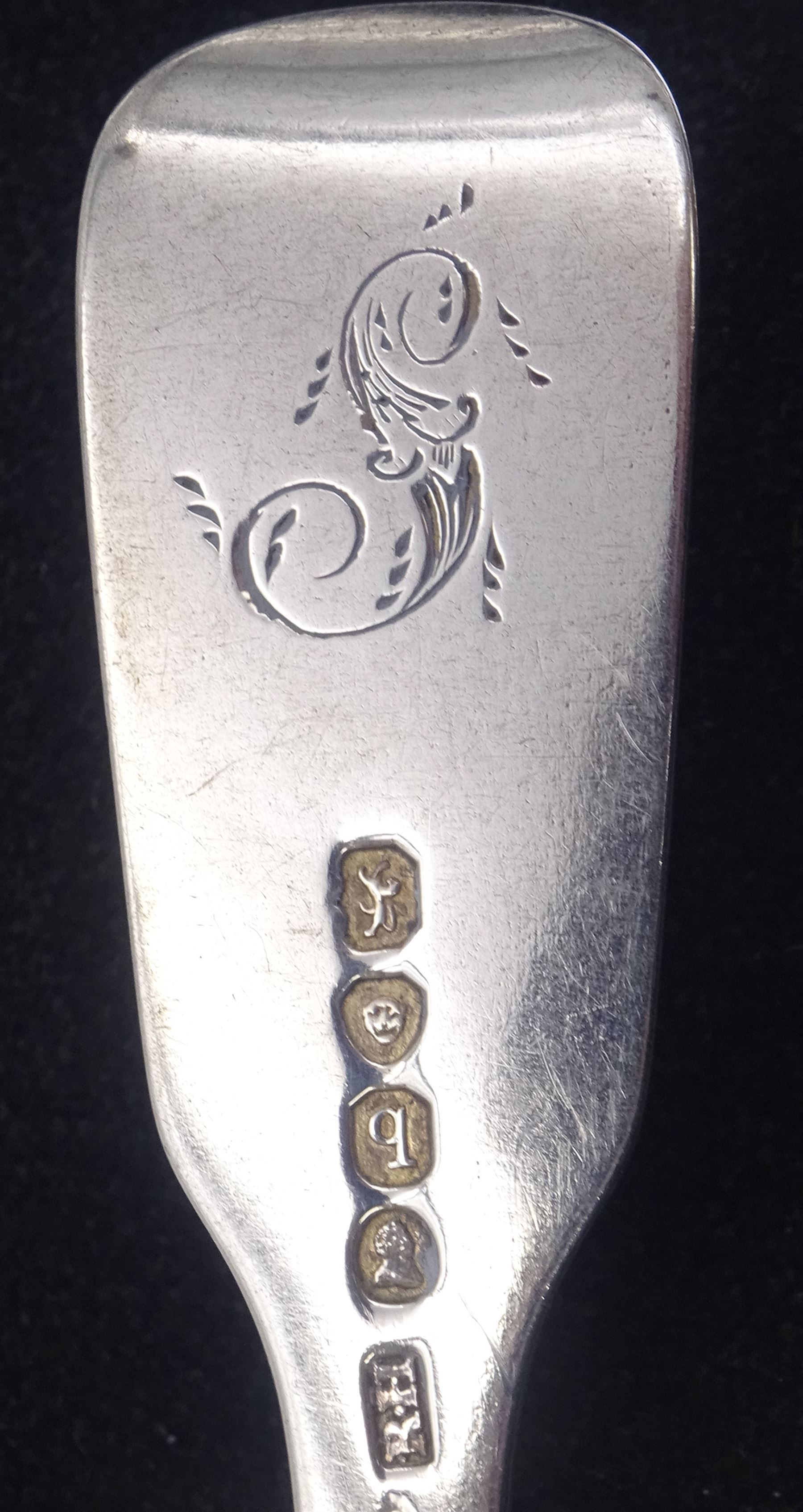 Three George IV silver fiddle pattern dessert spoons, with engraved initial to terminal, hallmarked William Bateman I, London 1820, together with three William IV silver fiddle pattern forks, with engraved initial verso, two hallmarked London 1831, maker's mark R.H probably Robert Hennell II, and one hallmarked Jonathan Hayne, London 1836