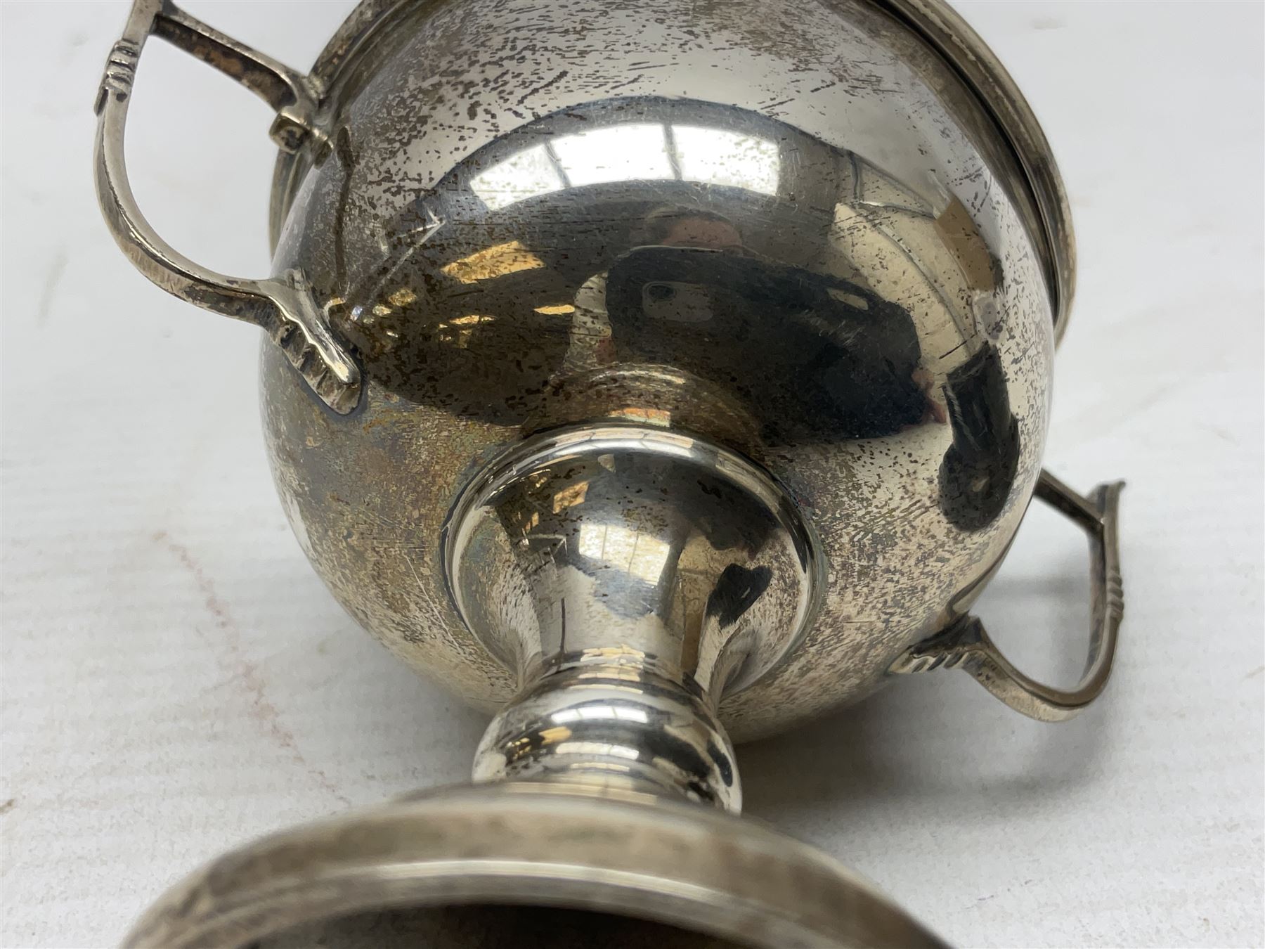 1930's silver twin handled trophy cup, upon black circular plinth, hallmarked Birmingham 1936, approximate silver weight 47 grams