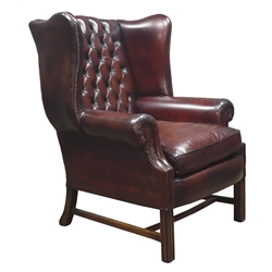  Large 20th century Georgian style wingback armchair, upholstered in buttoned dark brown leather, square moulded supports, W85cm  