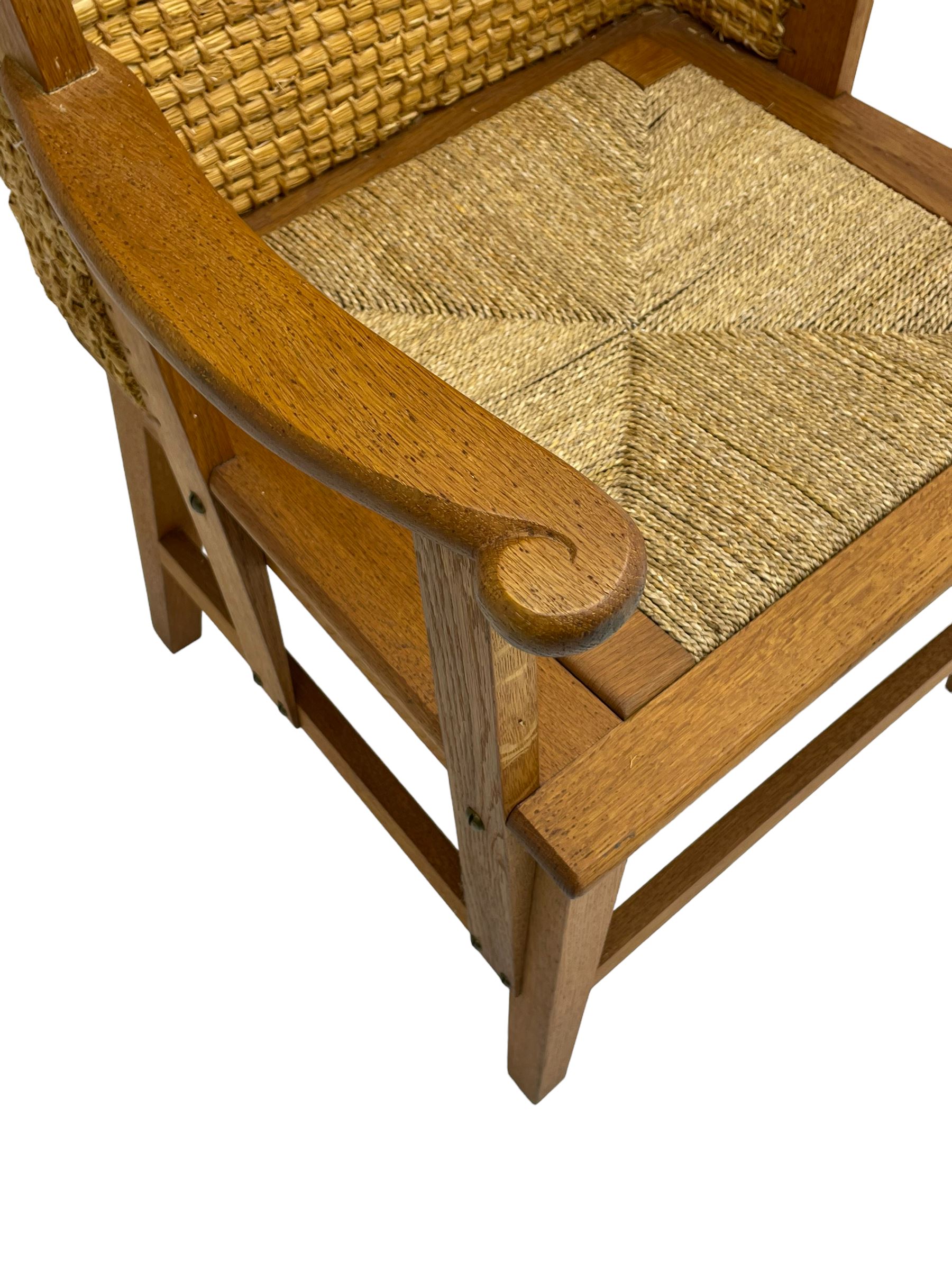 Reynold Eunson (1932–1978) for David Munro Kirkness, Kirkwall, Orkney - oak framed Orkney chair, woven straw canopy back, drop-in rush seat, the arm terminals carved with scrolls, on square tapering supports joined by plain stretchers, the front rail inscribed with makers marks