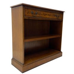 Georgian design low open bookcase, figured top with crossbanding and feather stringing, fitted with single cock-beaded drawer over a single adjustable, on skirted base