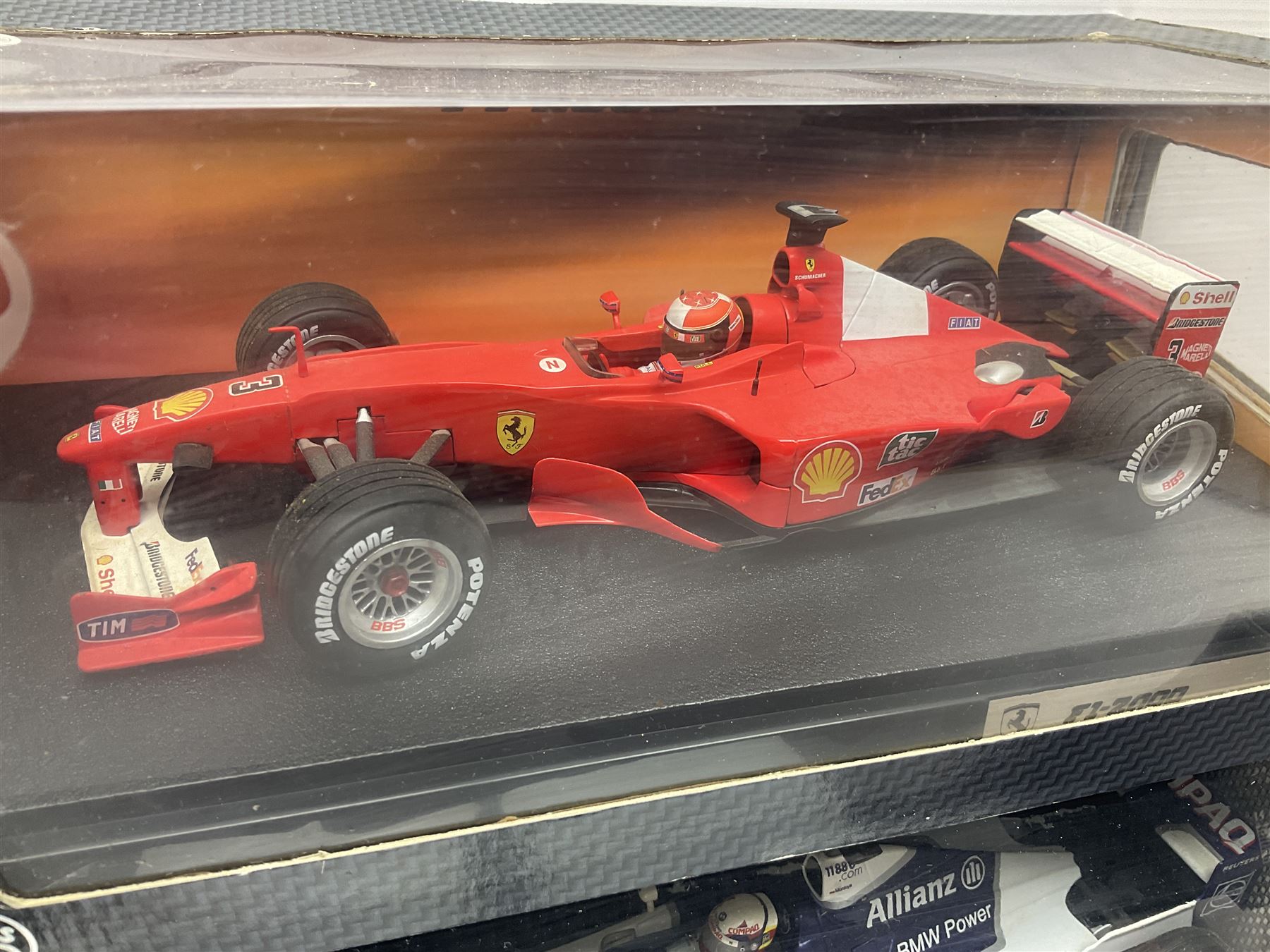 Five Mattel Hot Wheels 1:18 scale die-cast racing cars - Ferrari F1-2000 Michael Schumacher; Ferrari F-2002 Michael Schumacher; Jordan E-110 Heinz-Harald Frentzen; Williams F1 Team FW23Juan Pablo Montoya; and Ferrari F2001 Rubens Barrichello; all boxed (5)