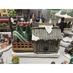 Christmas decorations; Premier LED Christmas Village scene with moving train, together with three Lumineo christmas scenes, and other similar 