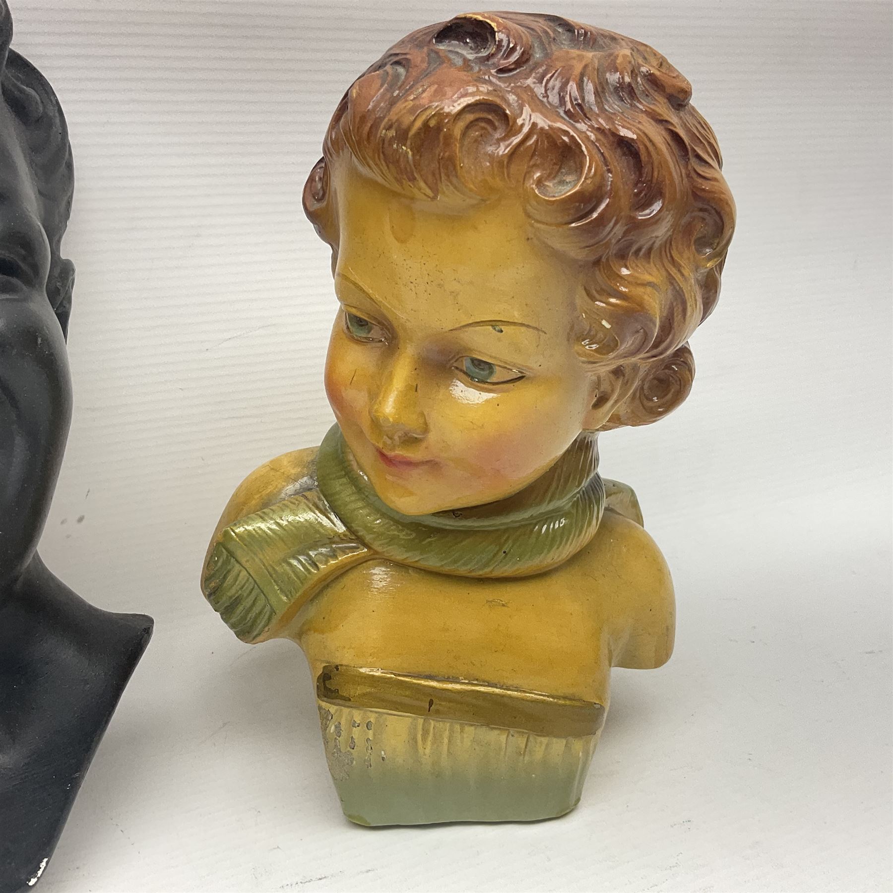 Art Deco plaster female bust, marked Arnova 353, together with a collection of wall masks 