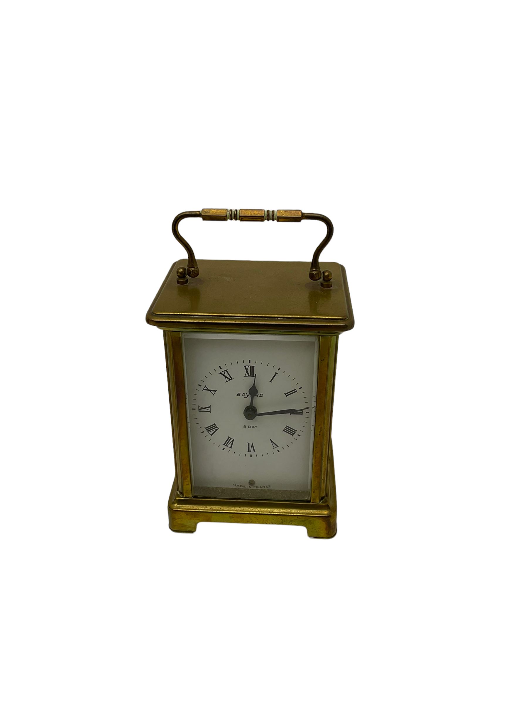 A French carriage clock by Duverdrey & Bloquel c1920, with three glass panels and white enamel dial, Roman numerals and minute markers, lever platform escapement and integral winding key. Together with a late 19th century American spring driven 30hr alarm clock by Seth Thomas of Connecticut USA c1890, in a wooden case with a white dial and brass alarm setting disc.   


