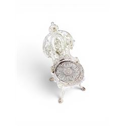 Pair of white painted cast metal garden chairs, ornate reclined backs, circular pierced seats on cabriole legs