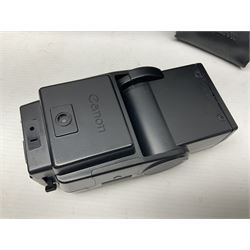 Canon A1 35mm camera body serial no 741264, with 'Tokina AT-X 28-85mm 1:3.5-4.5' lens serial no 821679, 'Canon FD 50mm 1:1.8mm' lens and other camera equipment 