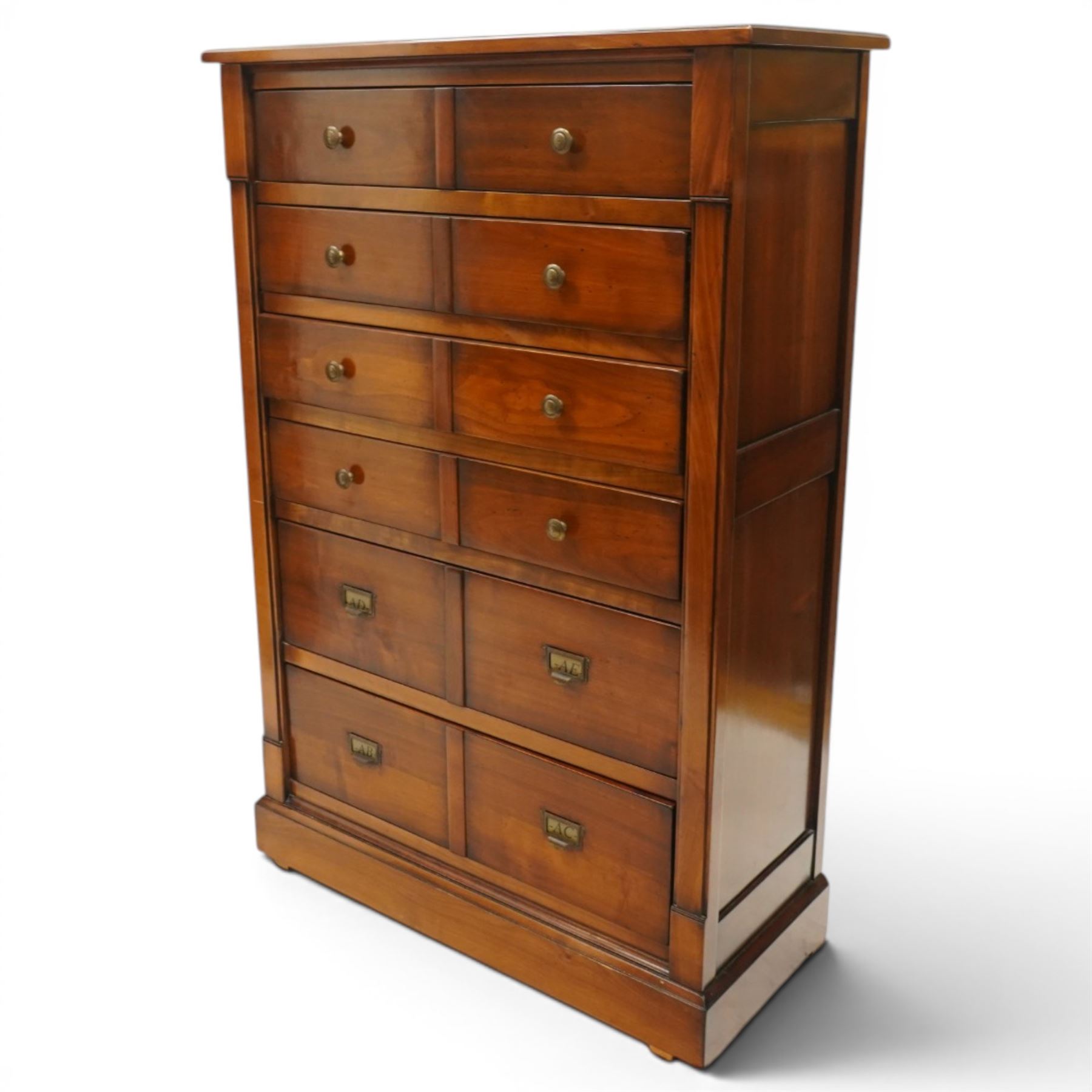 And So To Bed - cherrywood tall chest of six drawers, rectangular top over six long drawers, brass knobs and brass pulls with label holders, raised on a plinth base