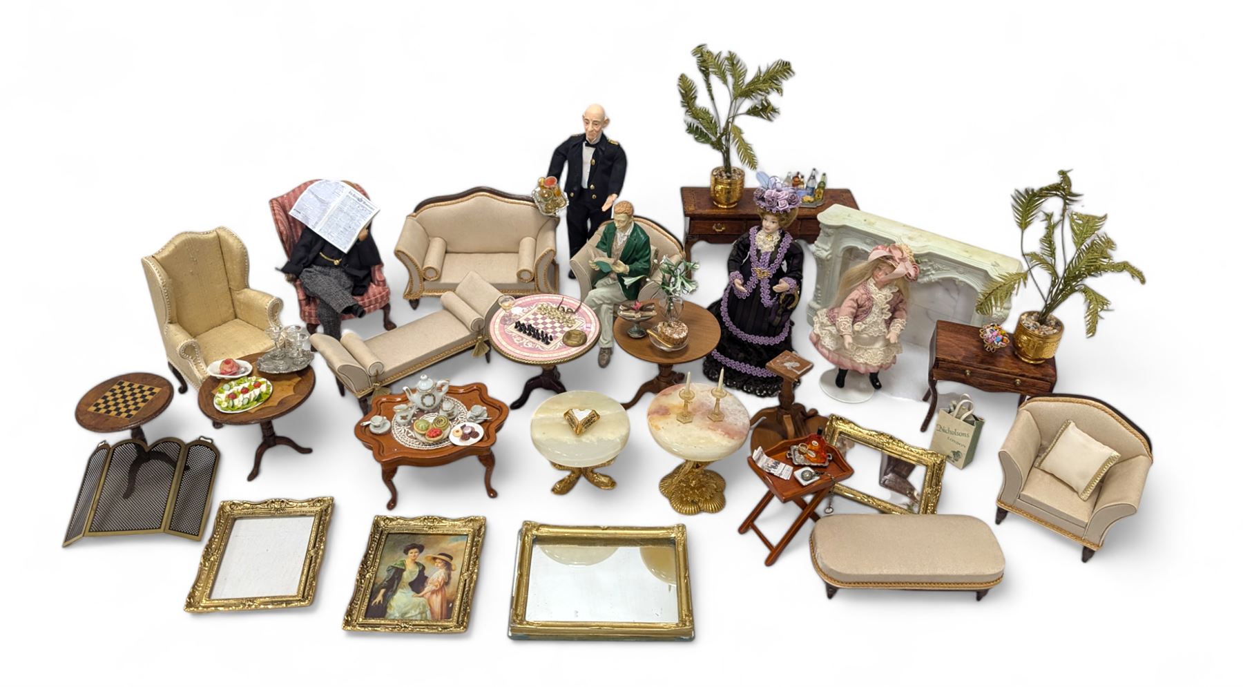 Dolls house furniture, including sofa, chairs, foot stools, fireplace, sideboards, five figures, mirrors, paintings and accessories