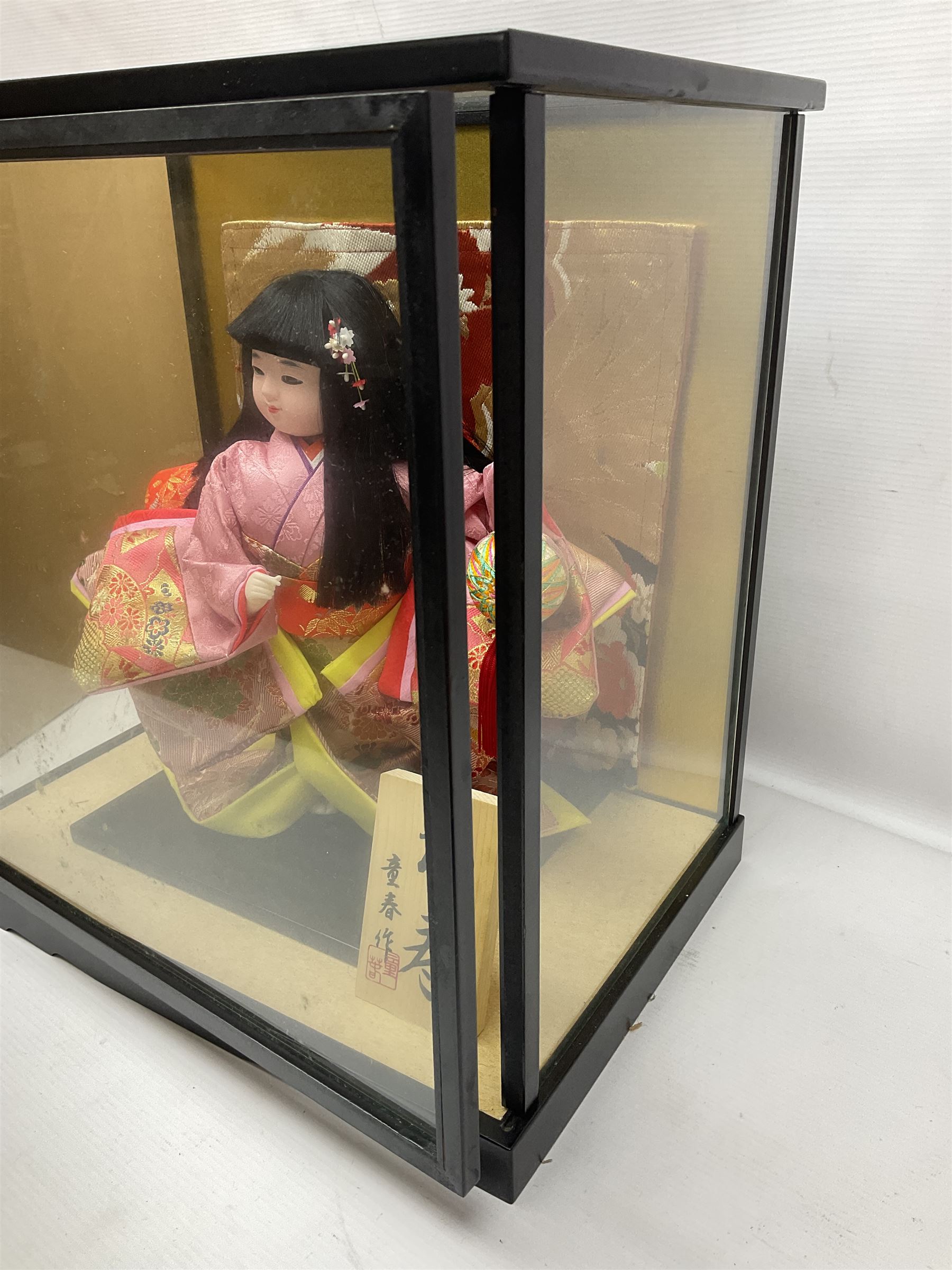 Japanese doll, dressed in traditional Japanese dress, within wooden glazed box, box H40cm