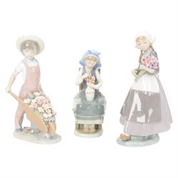 Three Lladro figures, comprising Spring Awakening 1283, Flower Harmony 1418 and Dutch girl with Tulips 5065