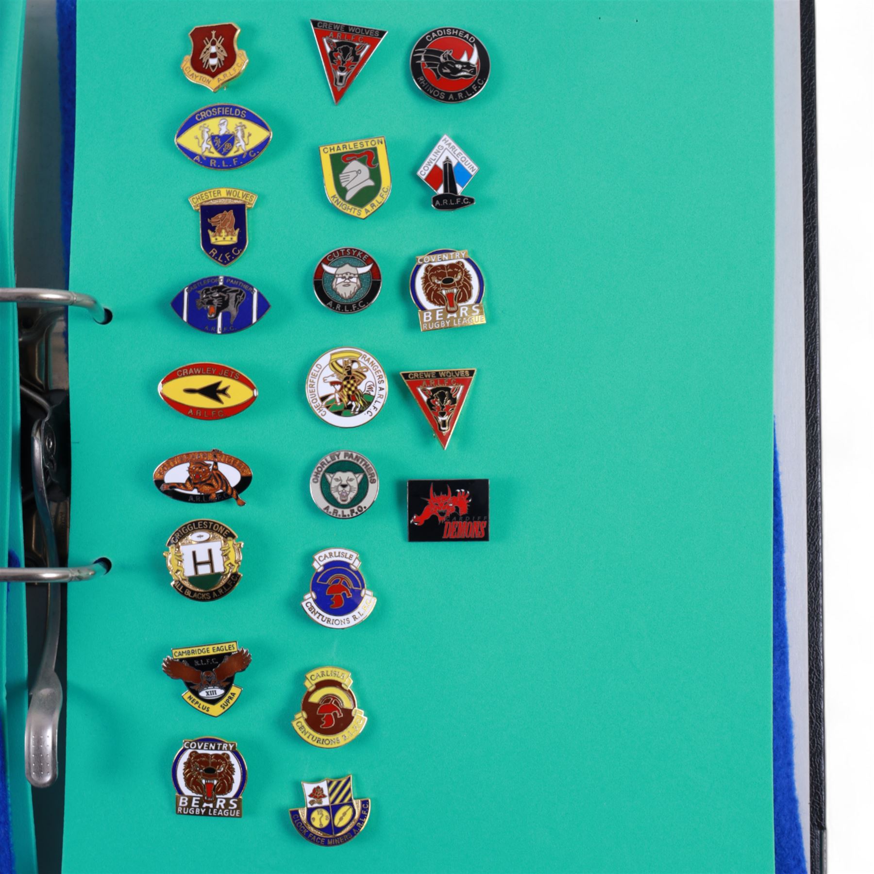 Amateur rugby league enamel badge collection, teams including Birmingham Bulldogs, Bridlington, Dudley Hill, Duke of York, Edinburgh Eagles, Guiseley, Rangers, Huntingdon, Keighley Town, Leigh Miners, Pilkington Recs, St Josephs, Thornhill Trojans, West London Sharks etc, all displayed in three folders and six amateur league badges from Leeds & District, Hull & District, York & District, Warrington, Lancashire County and Yorks County in box display, (approximately 270)