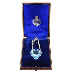 Platinum aquamarine and diamond pendant / brooch, the large faceted heart cut aquamarine, mounted within an openwork heart design gallery, suspending from a polished and milgrain set old cut diamond pendant, with bow design brooch top, set with further old cut diamonds and a single marquise cut diamond, in fitted velvet and silk lined box by Bloom & Sons, London, aquamarine approx 55.00 carat, total diamond weight approx 0.60 carat