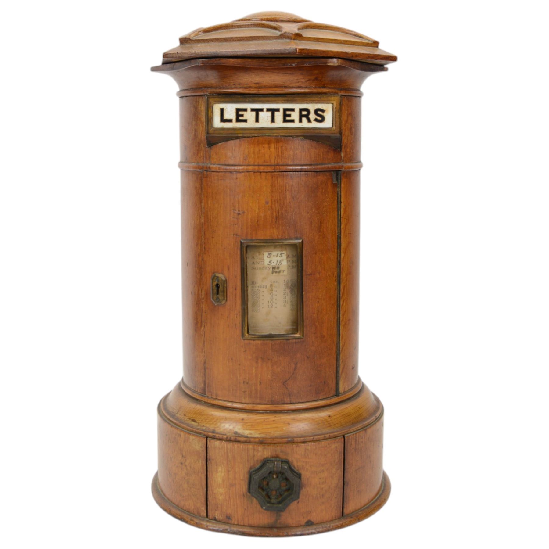 Victorian oak Country House domestic post box, of cylindrical form with hexagonal moulded domed top above a rectangular posting aperture detailed 'LETTERS', and hinged door with glazed aperture for posting times, upon a circular plinth with pull our drawer and canted drop handle, overall H43cm