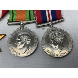 WW2 group of four medals comprising 1939-1945 War Medal, Defence Medal, Italy Star and 1939-1945 Star; with Royal Army Service Corps cap badge and RASC chrome and enamel sweetheart brooch