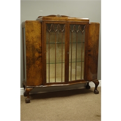  1930's figured walnut serpentine front display cabinet  on ball and claw feet, W120cm  
