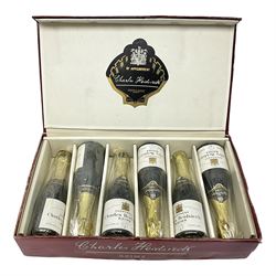 Charles Heidsieck champagne, set of six half bottles within red presentation box, unknown contents and proof 