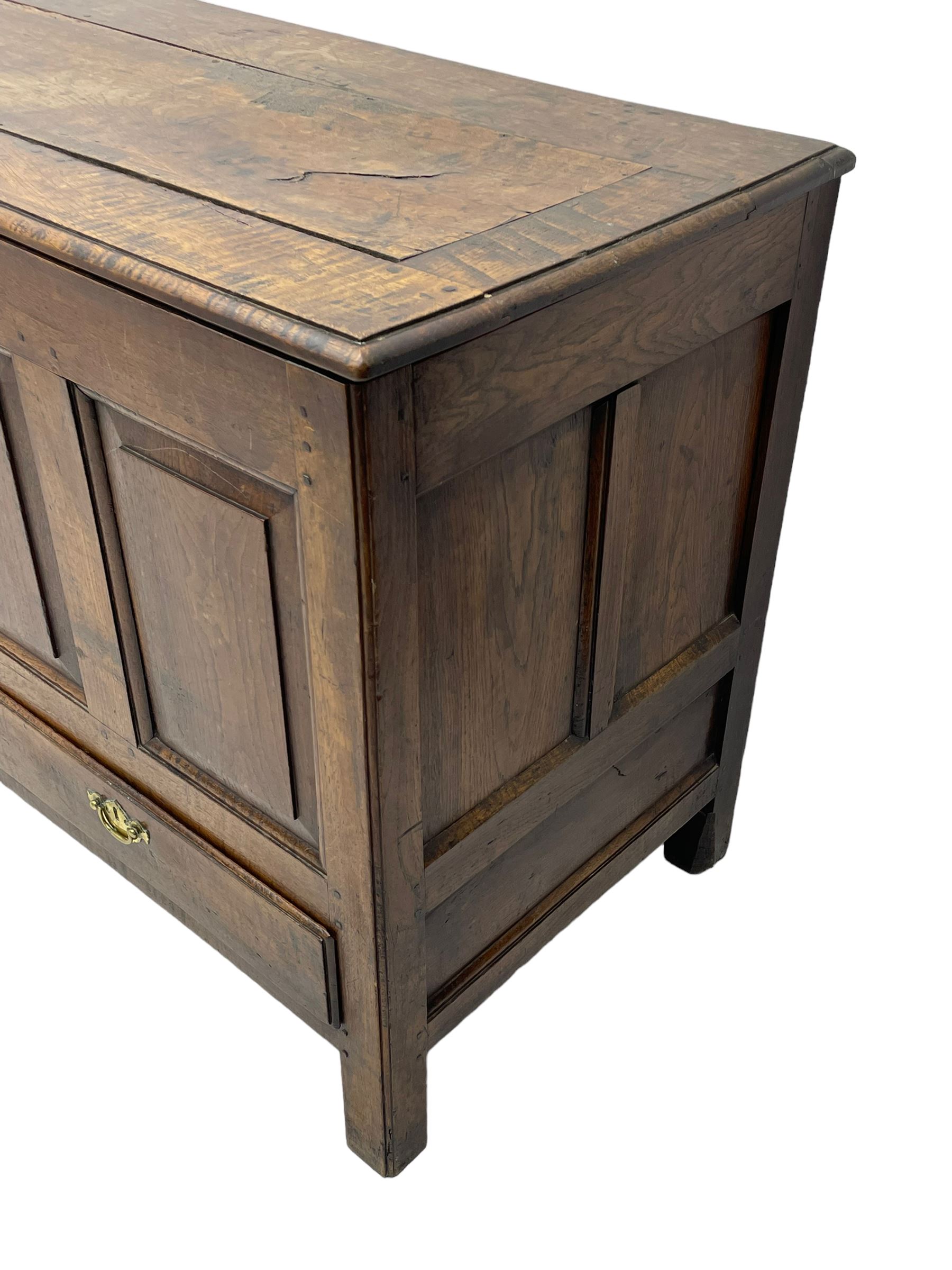 Georgian oak mule chest, moulded rectangular hinged lid over quadruple fielded panel front, the frieze inscribed '17 A Y 57', fitted with two drawers, panelled ends and back, on stile supports