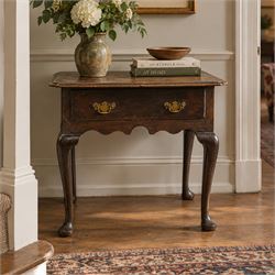 18th century oak lowboy, the rectangular top with moulded edge and eared front-corners, fi...