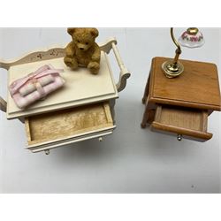 Collection of miniature dolls house furniture and accessories, to include four fabric topped tables, stand with jug and books, figural style table lamps, chairs, jardinière, Christmas themed furniture, etc