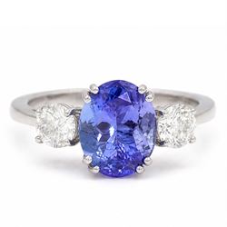 Platinum tanzanite and diamond three stone ring, single oval cut tanzanite of approx 3.55 ...