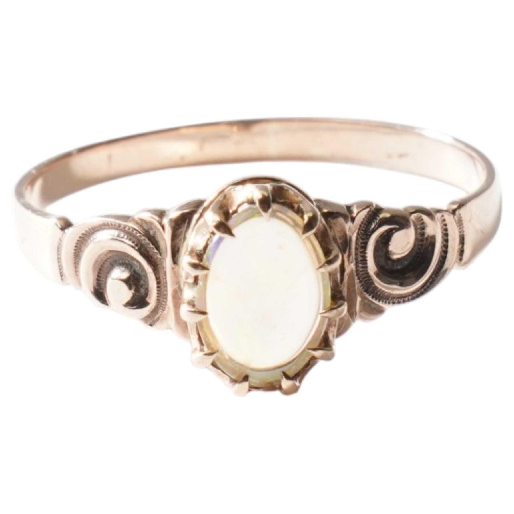 Gold single stone opal ring with scroll embossed shoulders