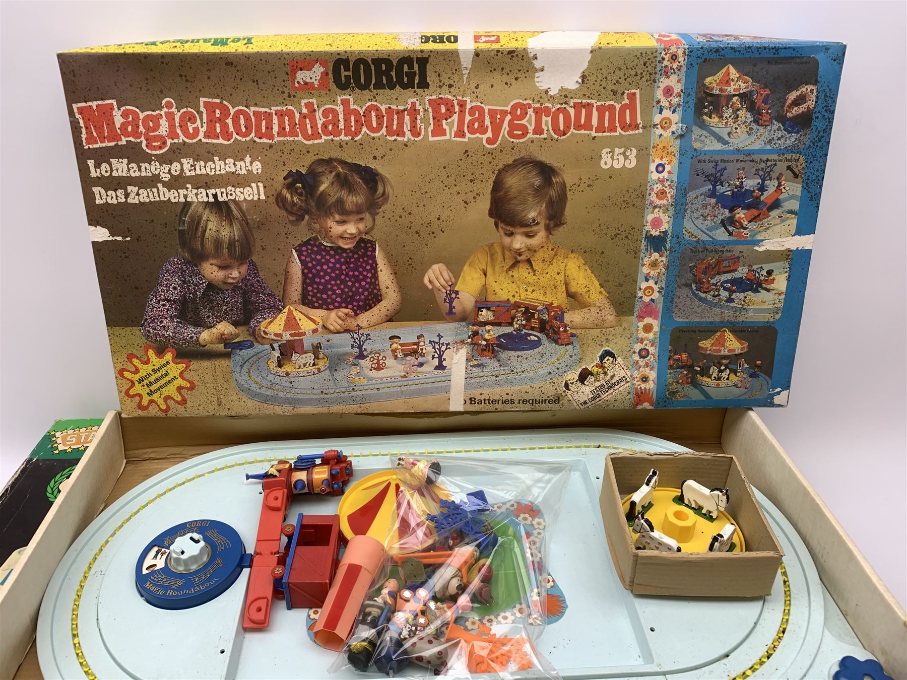 1970s Corgi Magic Roundabout Playground No.853; 1960s Bock Finland Pola600 table top football game; 1950s Pelham Puppet - Cowgirl; six Lledo Noddy in Toyland die-cast models; Good Soldiers set of five Noddy in Toyland cast metal figures; pair of Noddy and Big Ears painted wooden egg cups with hats; and DC Bronze Age Collection pair of Batmobiles; all boxed (13)