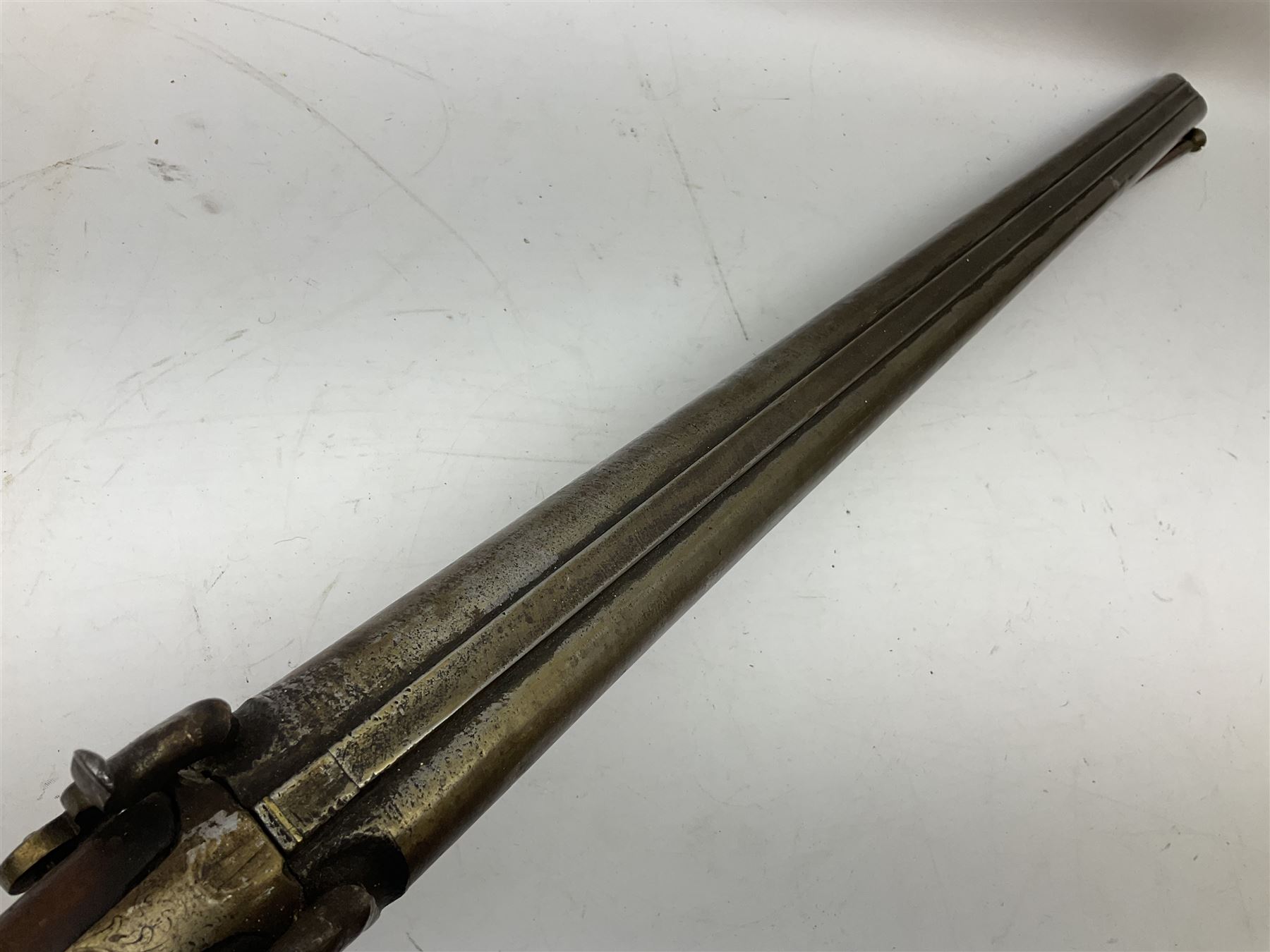 19th century 13-bore double barrel side-by-side percussion cap shotgun, the 72cm stub twist damascus barrels with ramrod under, walnut stock with chequered grip L117.5cm overall