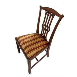 Set six Georgian design mahogany dining chairs, shaped cresting rail over pierced splat, drop in seat cushion upholstered in striped fabric, on square supports joined by H stretchers, two carvers and four side chairs 