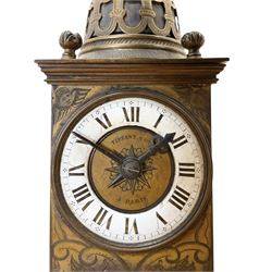 Tiffany- early 20th century brass cased 8-day mantle clock, rectangular case with engraved images taken from classical & mythological fables, with an open strapwork dome, finials to the corners and a cast figure of a standing maiden, case raised on a splayed base with acanthus engraving, enamel dial with Roman numerals, minute markers and steel hands, dial centre engraved Tiffany & Co Paris, twin train French movement with a platform escapement wound from the rear, baseplate of case stamped with the serial numbers 4372 & 5652. With key. 
Provenance from Chatsworth House, Derbyshire.