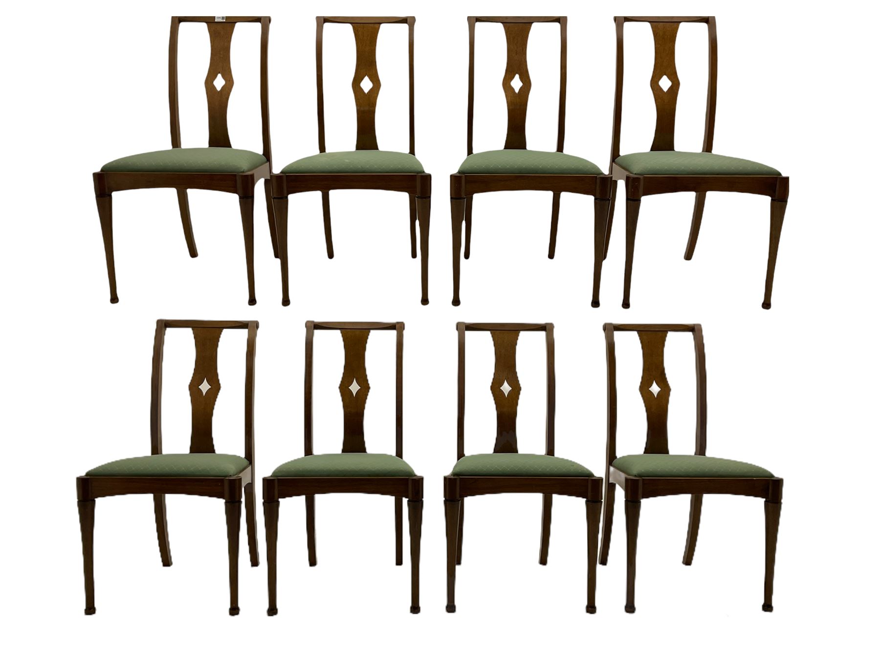 Set of eight contemporary walnut dining chairs, curved backs set with shaped splats with pierced detail, drop in upholstered seat cushions, on turned supports 