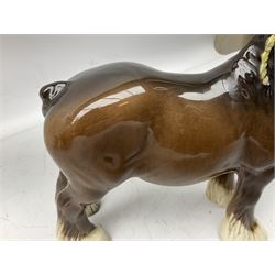 Three Beswick models comprising Hereford Bull no 949, 'CH Cutmil Cupie' Pug, and bay Shire horse, all with printed marks beneath